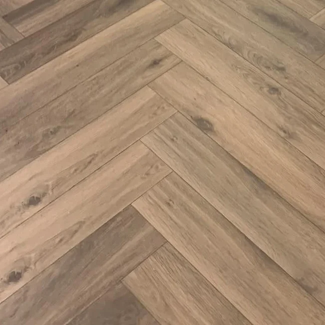 Warm brown solid oak herringbone flooring with natural grain detail