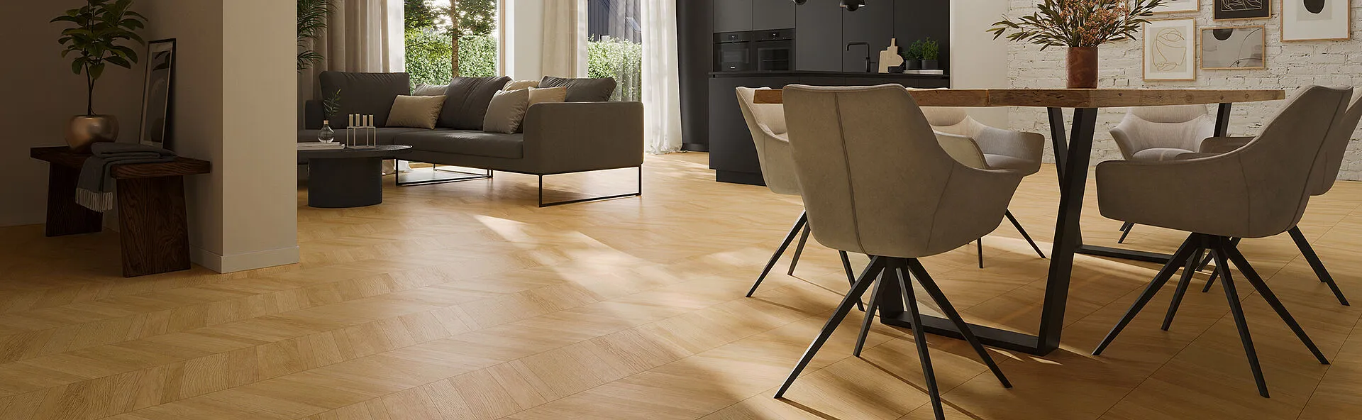 Natural oak herringbone flooring laid across a bright open-plan living room