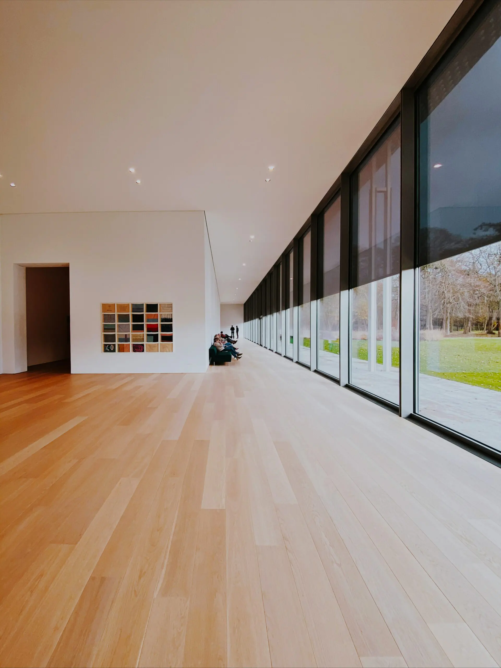 Spacious modern interior with pale natural oak hardwood plank flooring