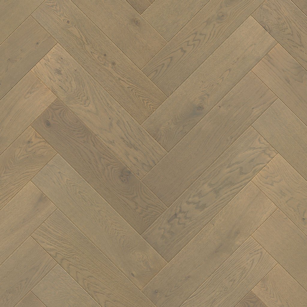 Close-up of oak herringbone flooring showing the classic right-angle plank arrangement