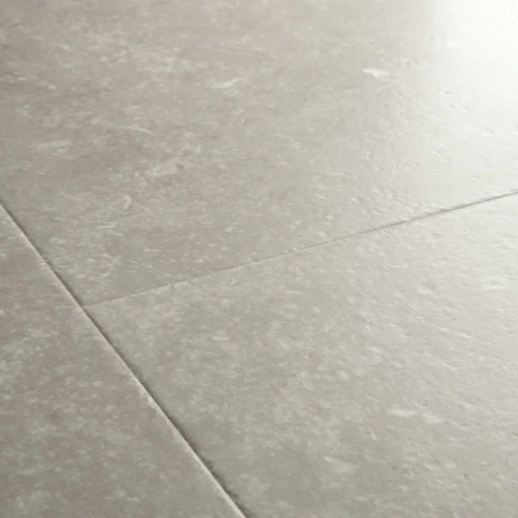 Light grey speckled stone effect flooring surface