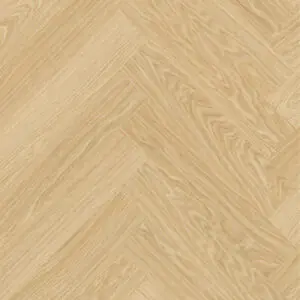 Close-up of pale oak herringbone vinyl planks showing the wood grain