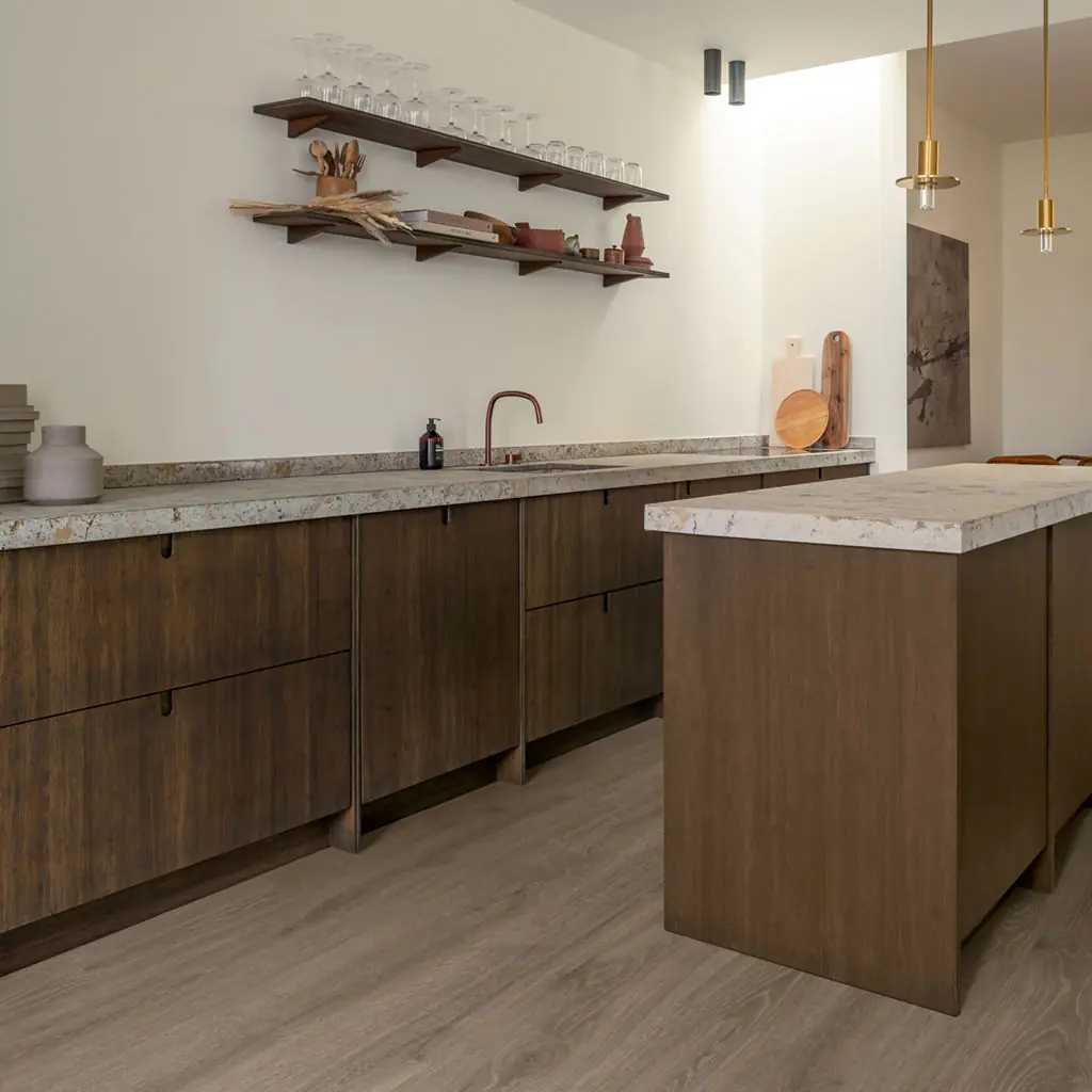 Light grey oak laminate flooring in modern kitchen with dark wood cabinets Ireland