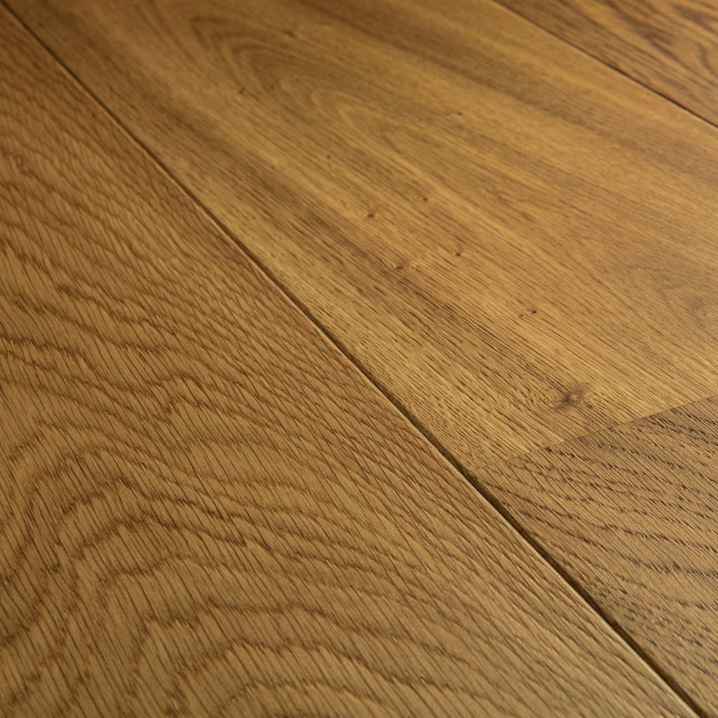 Close-up of a wide engineered oak plank showing the real wood grain of its top layer